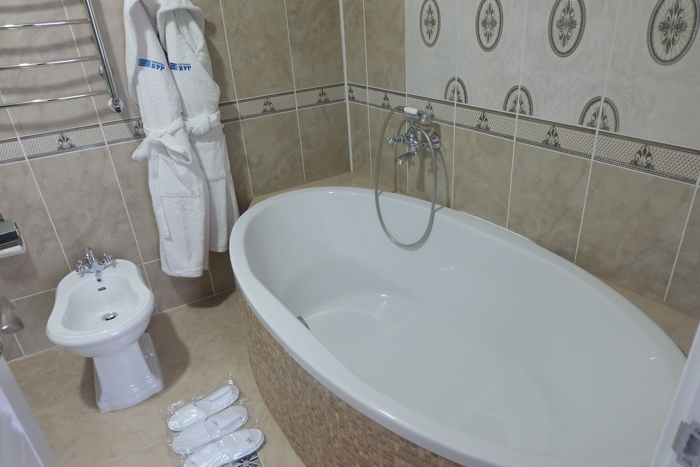 deluxe room | bathroom | shower, free toiletries, hair dryer, towels