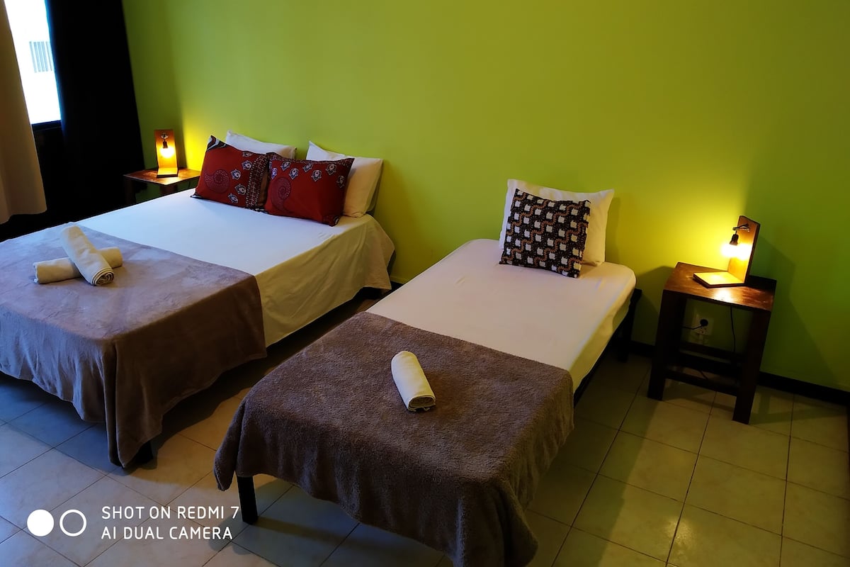Standard Triple Room, Multiple Beds, Shared Bathroom, City View | Individually decorated, free WiFi, bed sheets
