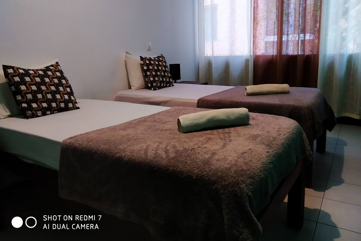 Basic Twin Room, 2 Single Beds, Shared Bathroom, City View | Individually decorated, free WiFi, bed sheets