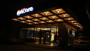 A hotel entrance with a prominent sign, a glass facade, and a modern design. - Ramada Encore by Wyndham Jalandhar (Jalandhar)