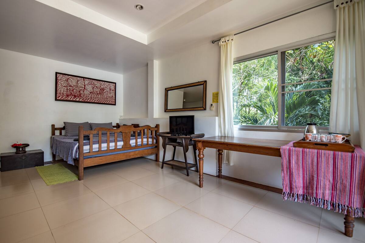 garden view suite | in-room safe, individually decorated, individually furnished, desk