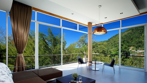 A modern living room with a large window, a sofa, a coffee table, and two chairs. - Presidential Penhouse - Kamala (Kamala)