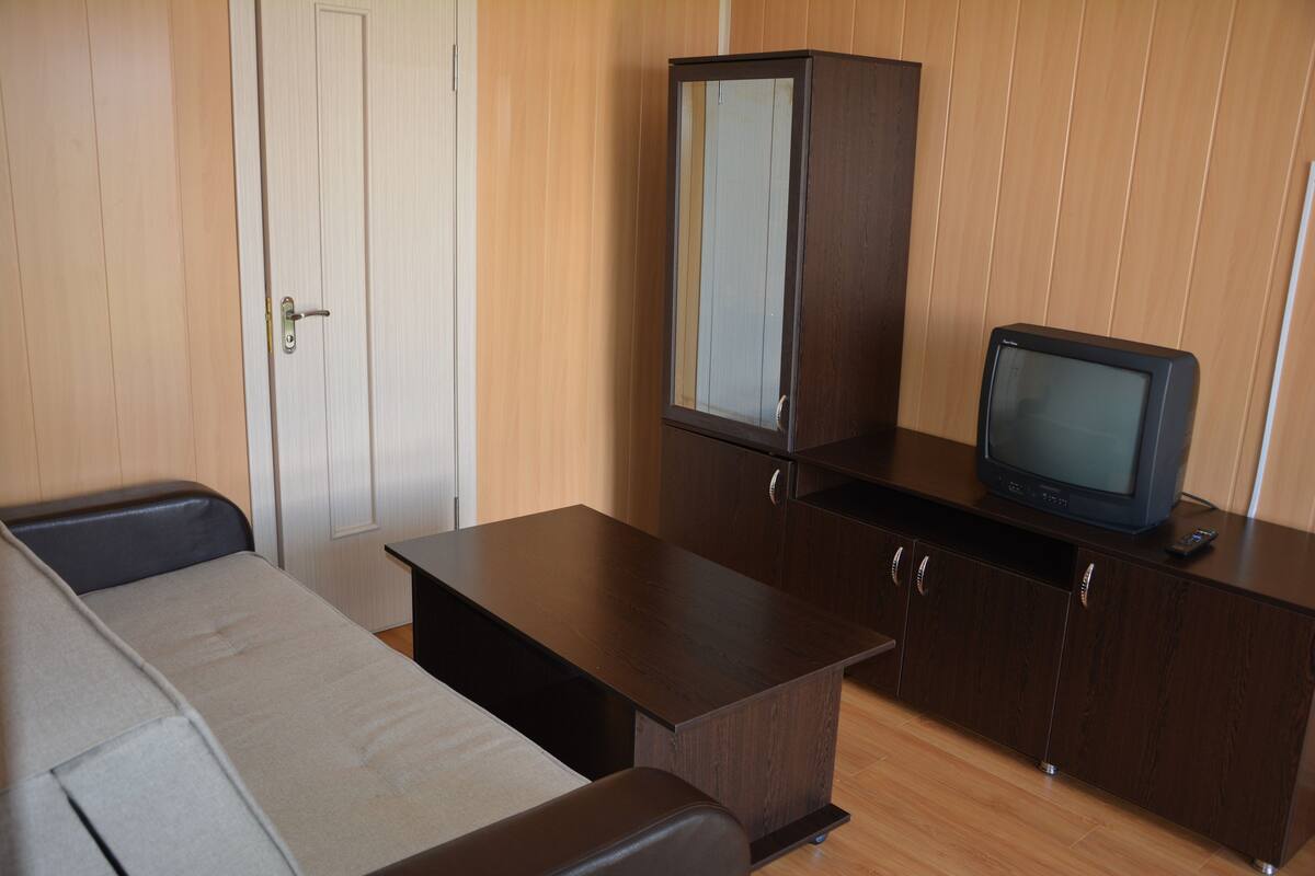 Luxury Suite, 1 Bedroom, Mountain View | Living area | TV