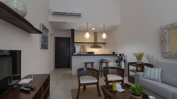 Family Studio Suite, 2 Bedrooms, 2 Bathrooms, Garden Area | Living room | Flat-screen TV