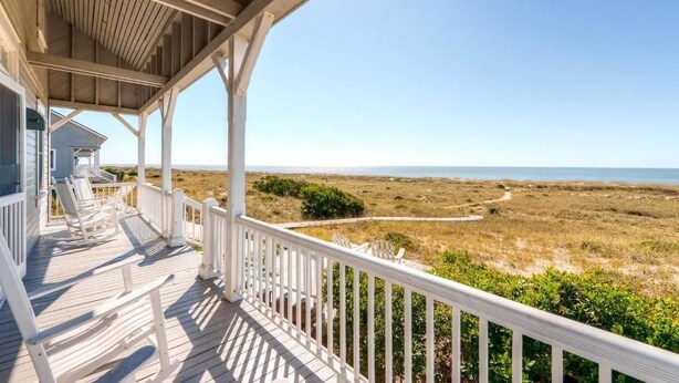 A wooden deck with white railings, overlooking a beach and dunes. - Captain Charlie s 1 3 Bedroom Holiday Home By Bald Head Island (Bald Head Island)