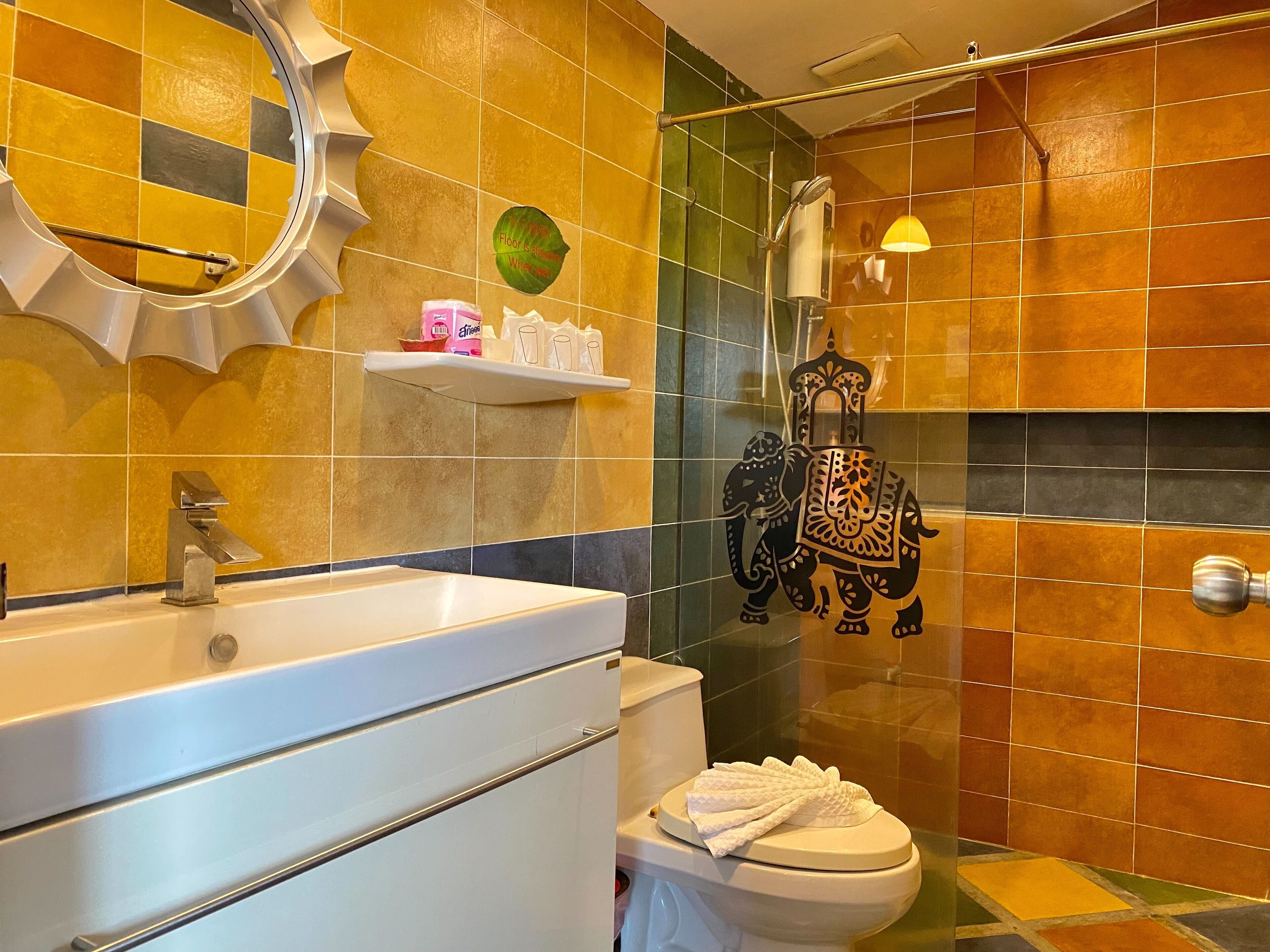 deluxe family room | bathroom | shower, free toiletries, slippers, towels