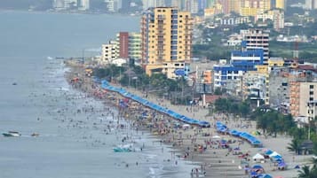 On the beach, sun-loungers