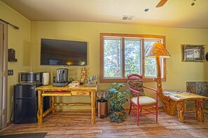 Deluxe Room, 1 Bedroom, Golf View, Ground Floor | Living area | 50-inch flat-screen TV with satellite channels, Smart TV, heated floors - IVACAZ Suites on the Golf Course (Pagosa Springs)