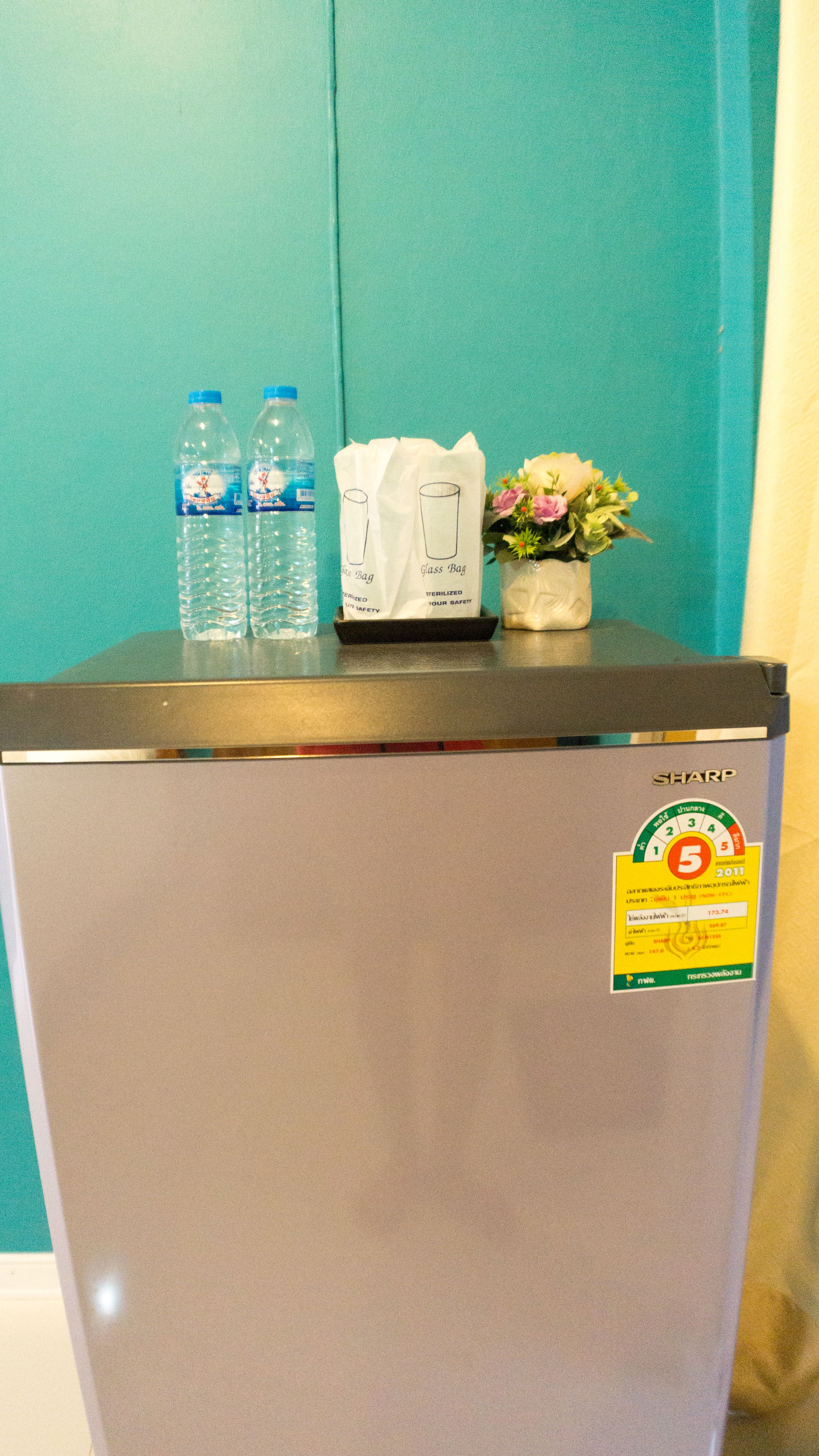 A refrigerator with a sticker indicating a 5-star rating and a date of 2011.
