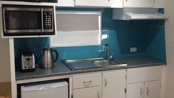 6-berth Cabin (Shared Bathroom) | Private kitchen | Fridge, microwave, stovetop, electric kettle