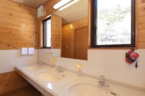 A wooden cabin bathroom with two sinks, a mirror, and a window. - Kawaguchiko country cottage Ban (Fujikawaguchiko)