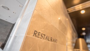 A wall with the word "RESTAURANT" in capital letters, indicating a dining establishment. - Hotel Links Namba (Osaka)
