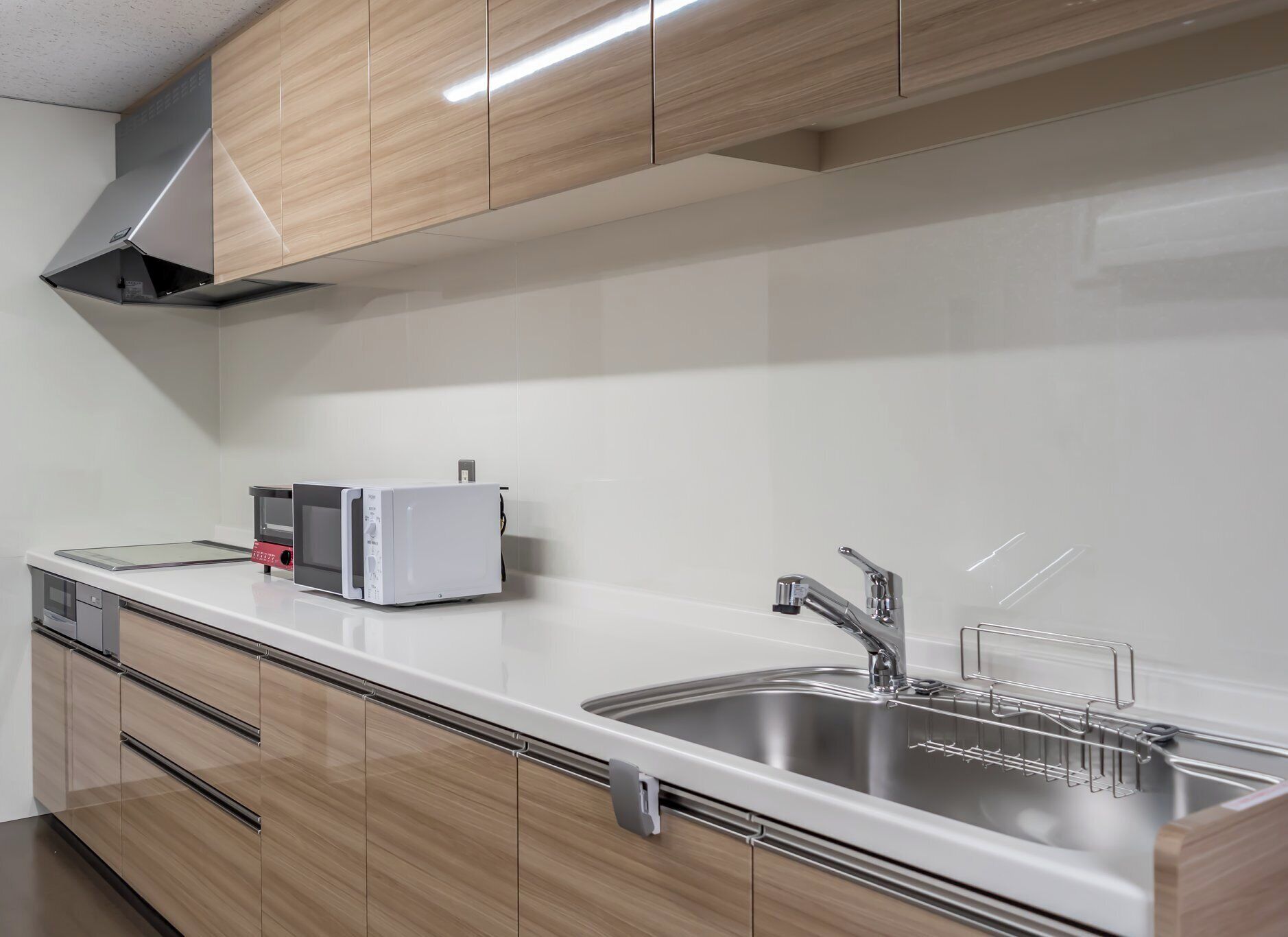 mini-fridge, microwave, oven, stovetop