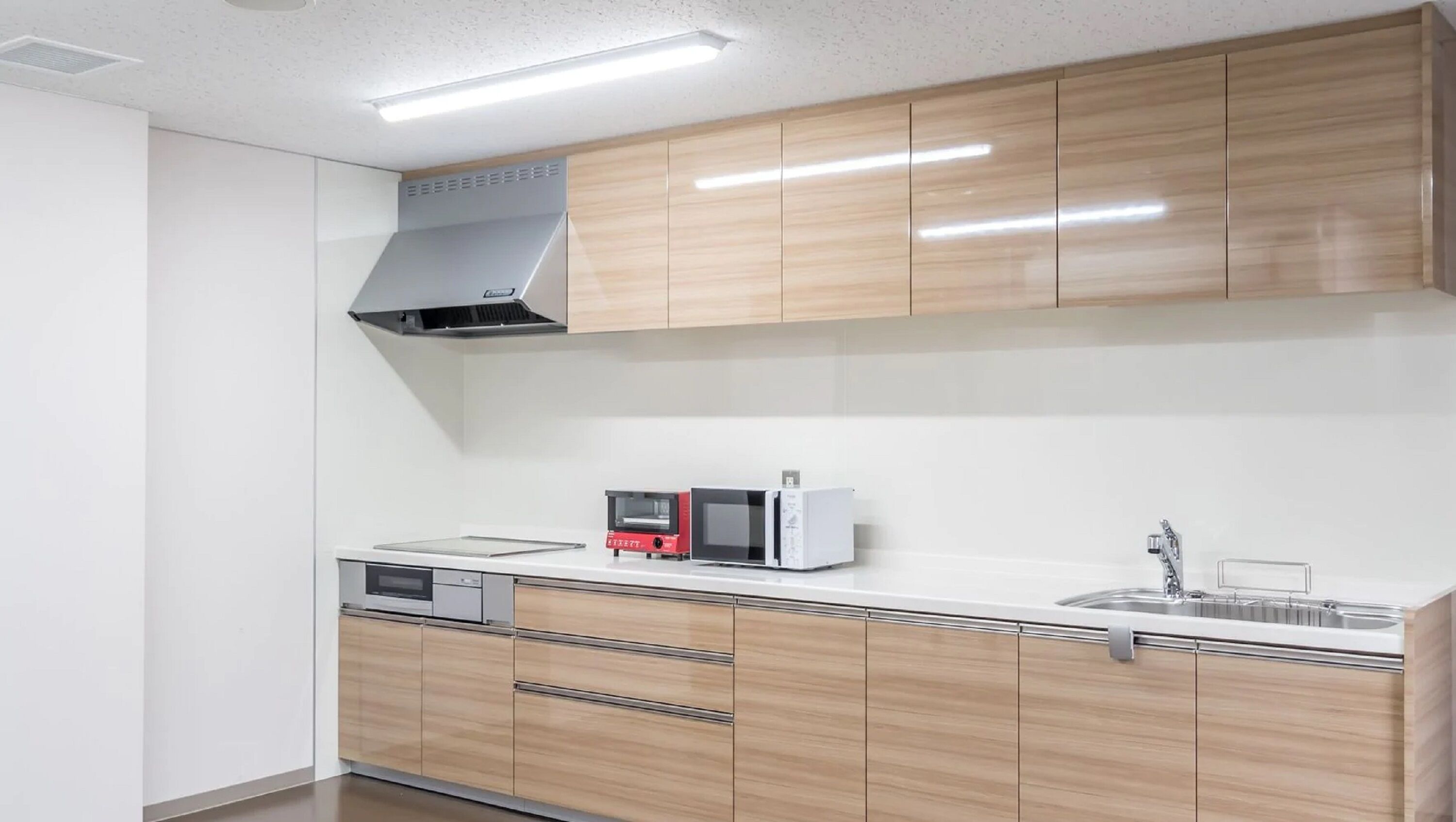 mini-fridge, microwave, oven, stovetop