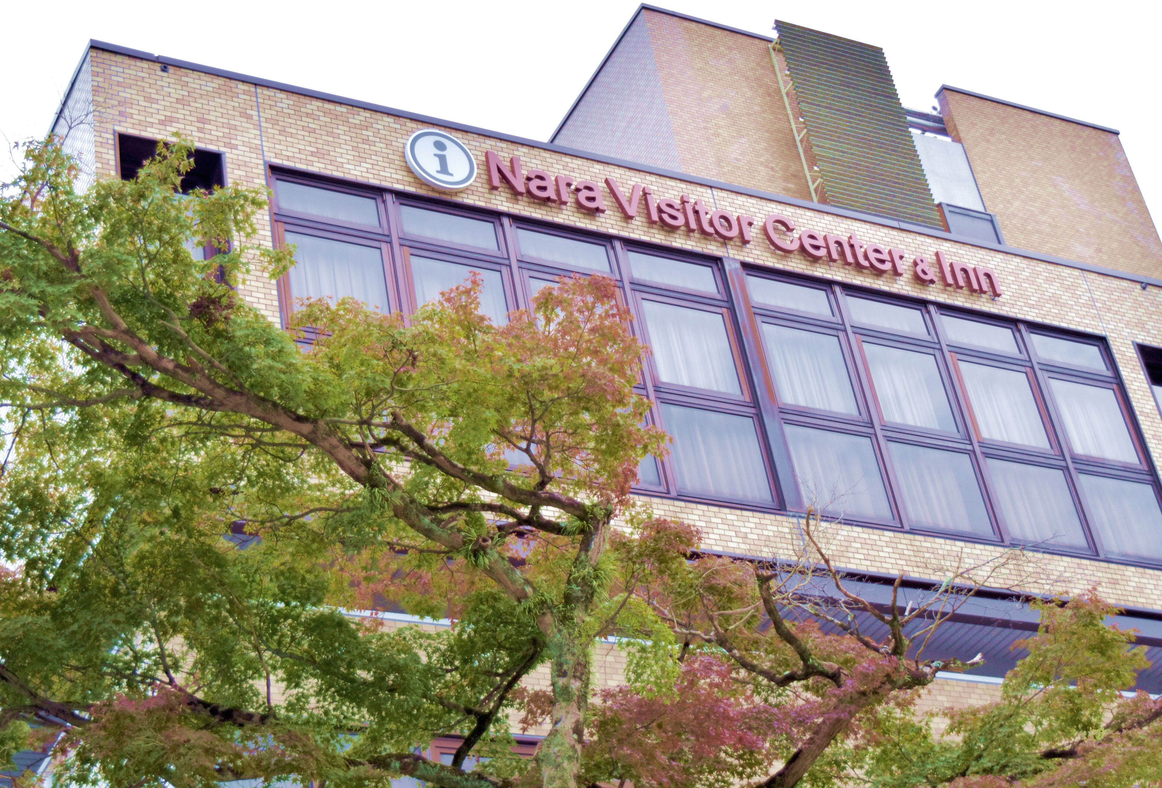 A building with a sign reading "Nara Visitor Center & Inn".