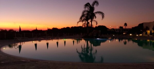 Seasonal outdoor pool, pool umbrellas, pool loungers