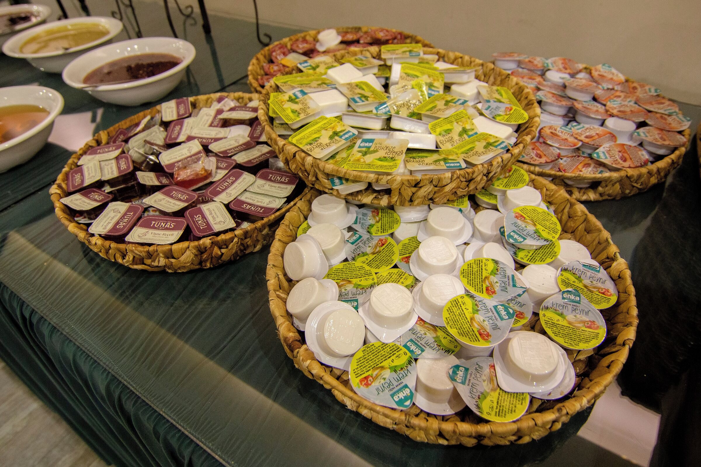 A buffet table with various food items and dairy products.