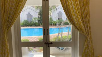 Luxury Suite, 1 Bedroom, Pool View | Egyptian cotton sheets, premium bedding, pillow-top beds