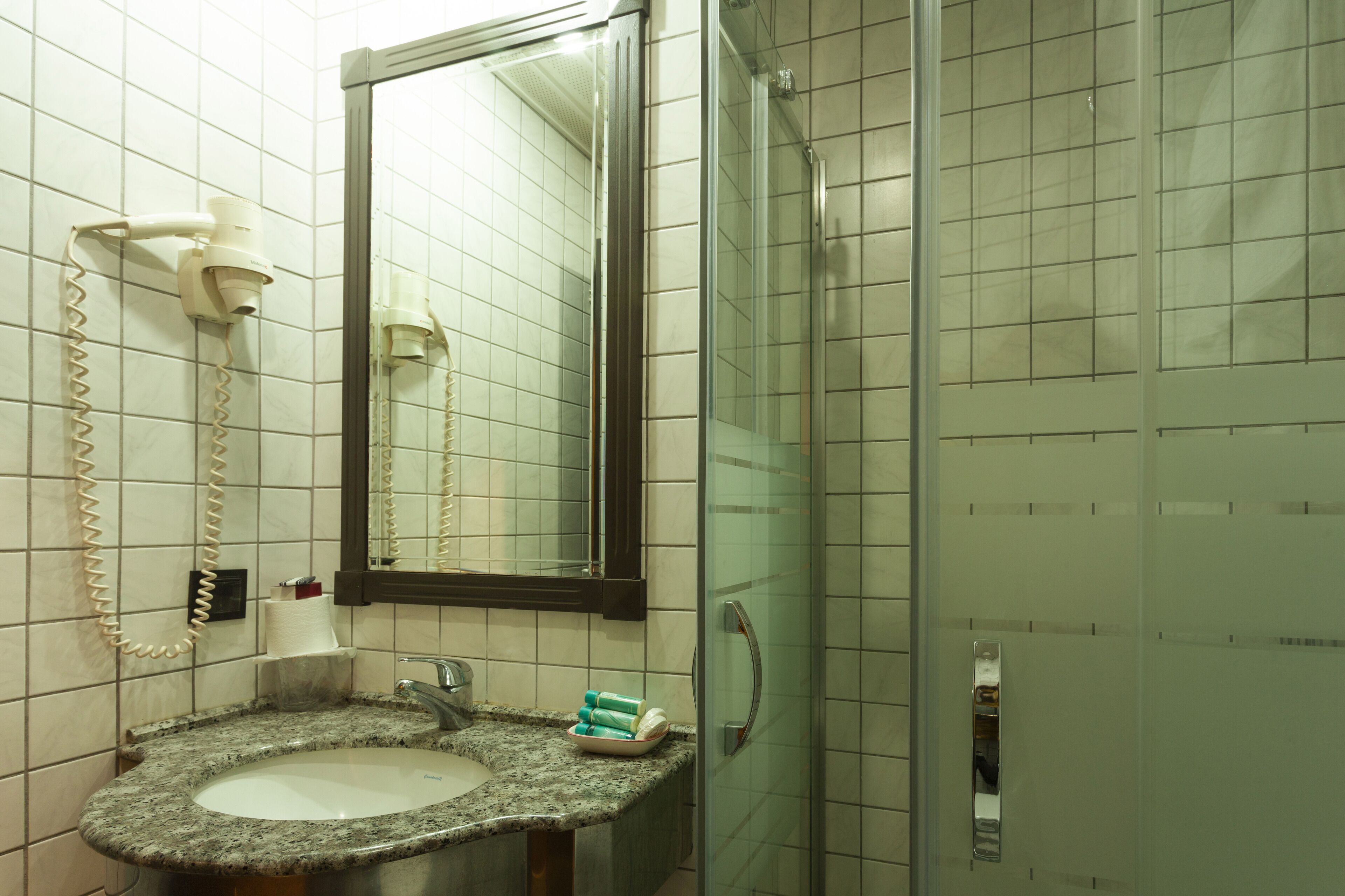 shower, free toiletries, hair dryer, slippers