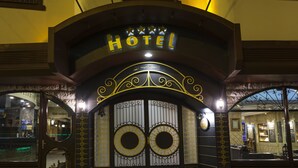 A hotel entrance with a sign reading "HOTEL" and decorative ironwork. - Balikcilar Hotel (Konya)