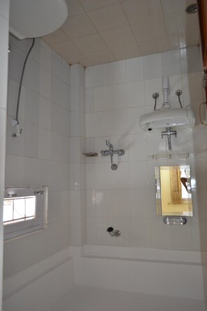 Shower, free toiletries, hair dryer, slippers