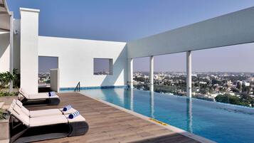 Outdoor pool, open 7 AM to 7:00 PM, pool loungers