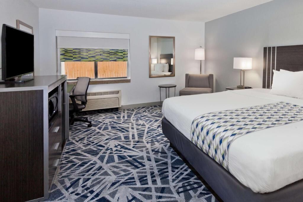 Desk, laptop workspace, blackout curtains, iron/ironing board