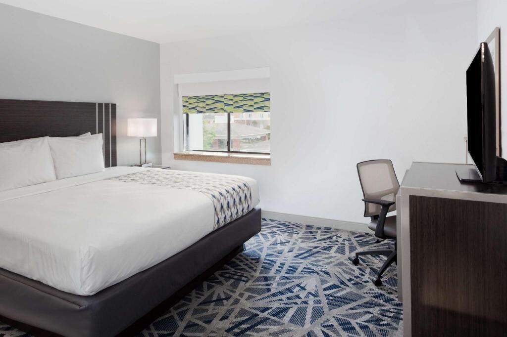 Desk, laptop workspace, blackout curtains, iron/ironing board