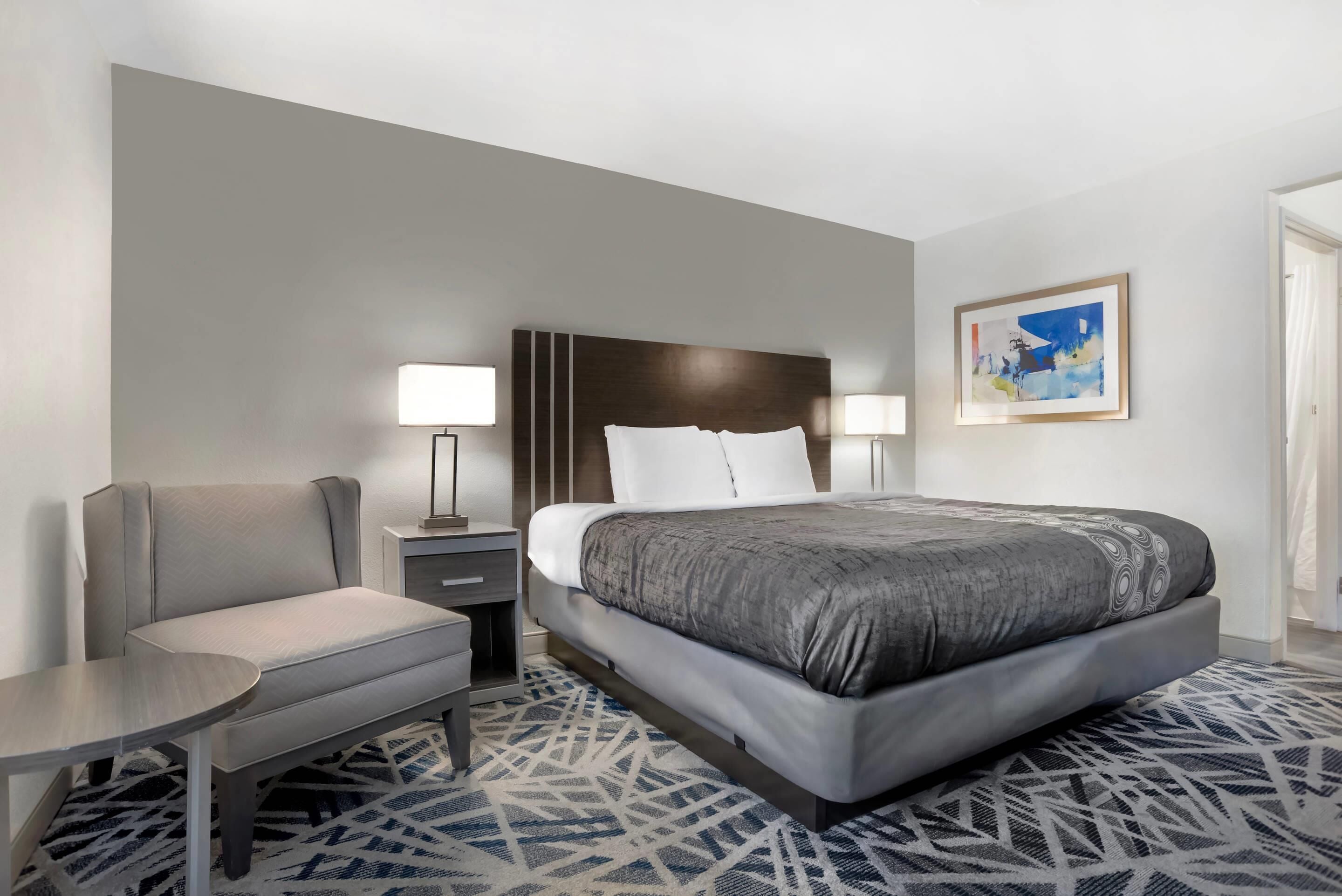 Desk, laptop workspace, blackout drapes, iron/ironing board