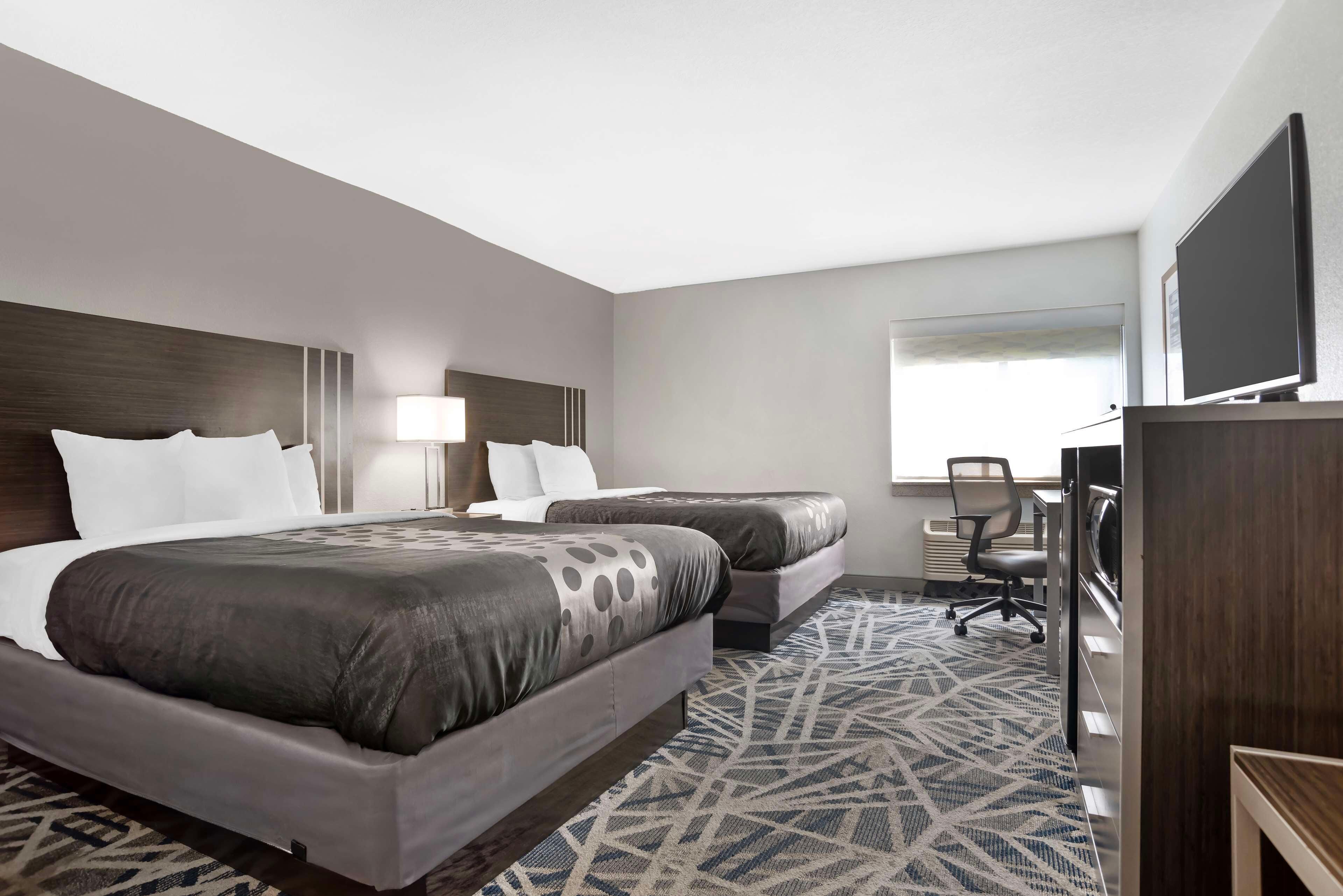 Desk, laptop workspace, blackout drapes, iron/ironing board