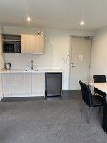 Executive Room, 1 Bedroom, Refrigerator & Microwave (First Floor) | Private kitchen | Fridge, microwave, coffee/tea maker, electric kettle