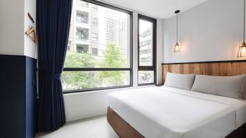 Premium bedding, desk, blackout drapes, soundproofing