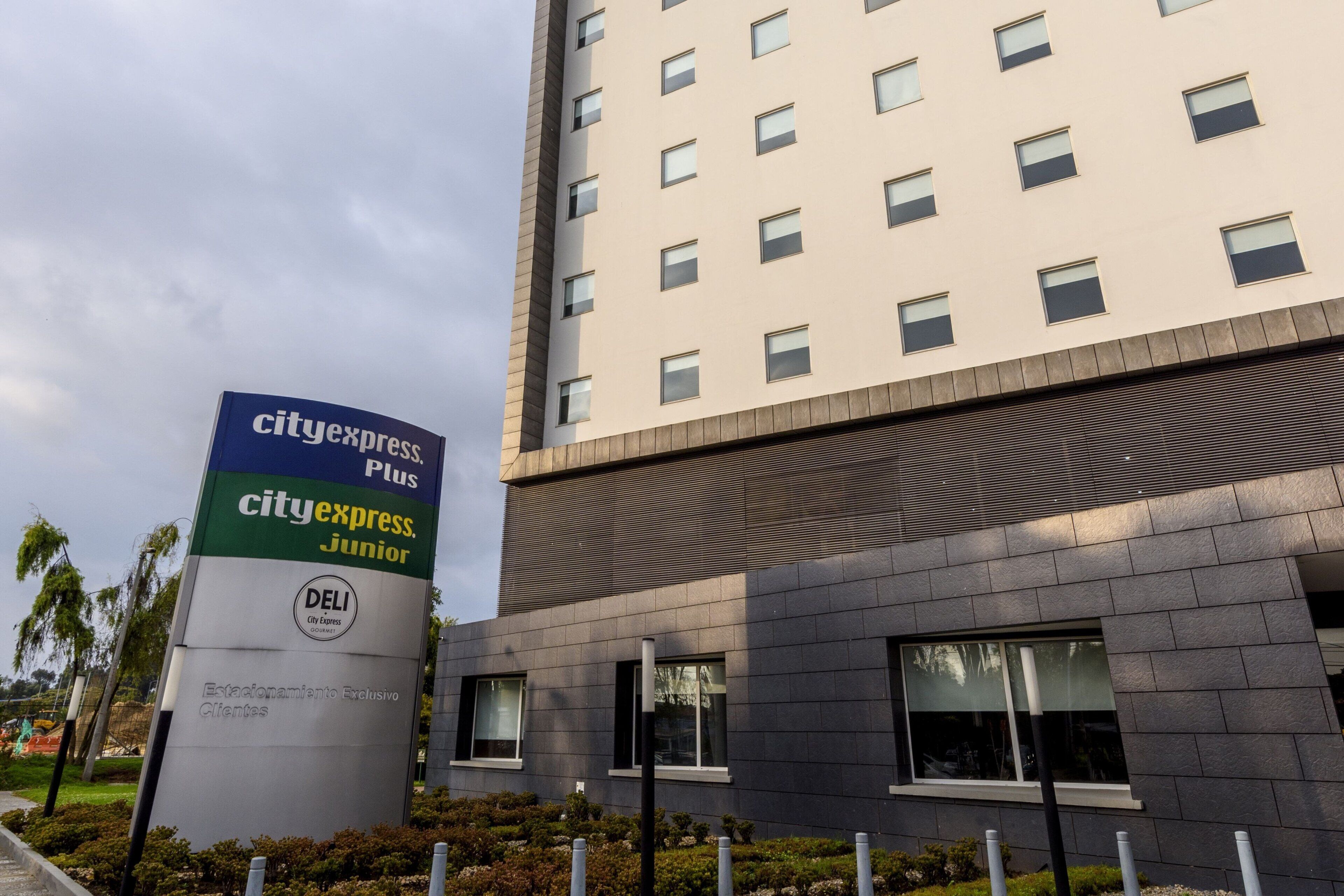 A modern building with a sign for CityExpress Junior.