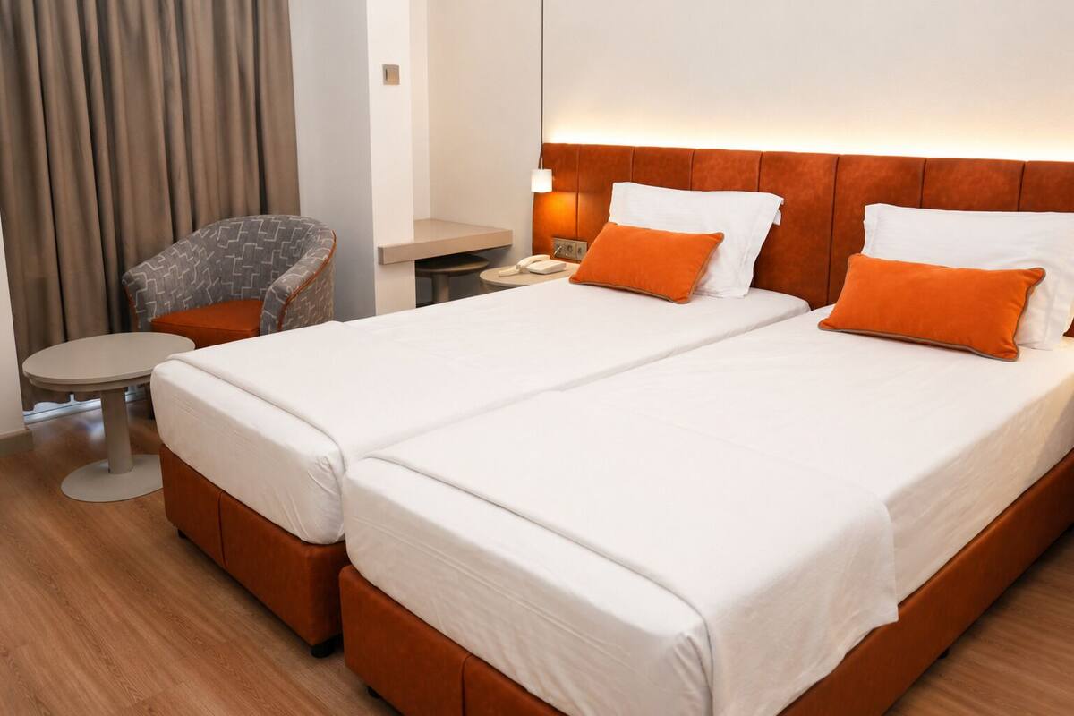 Chambre Économique avec lits jumeaux | Minibar, bureau, chambres insonorisées, Wi-Fi gratuit