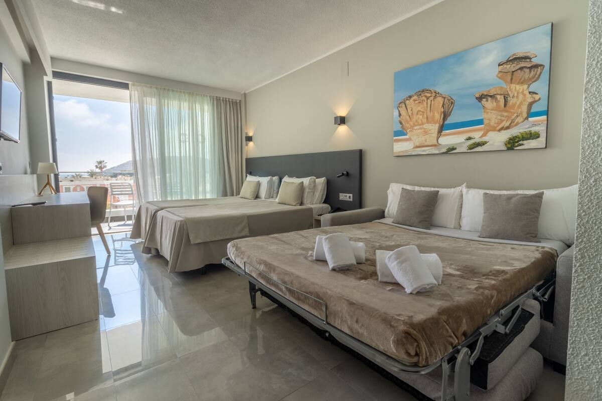 deluxe quadruple room, pool view (2 extra beds, 4 adults) | 1 bedroom, minibar, individually decorated, individually furnished