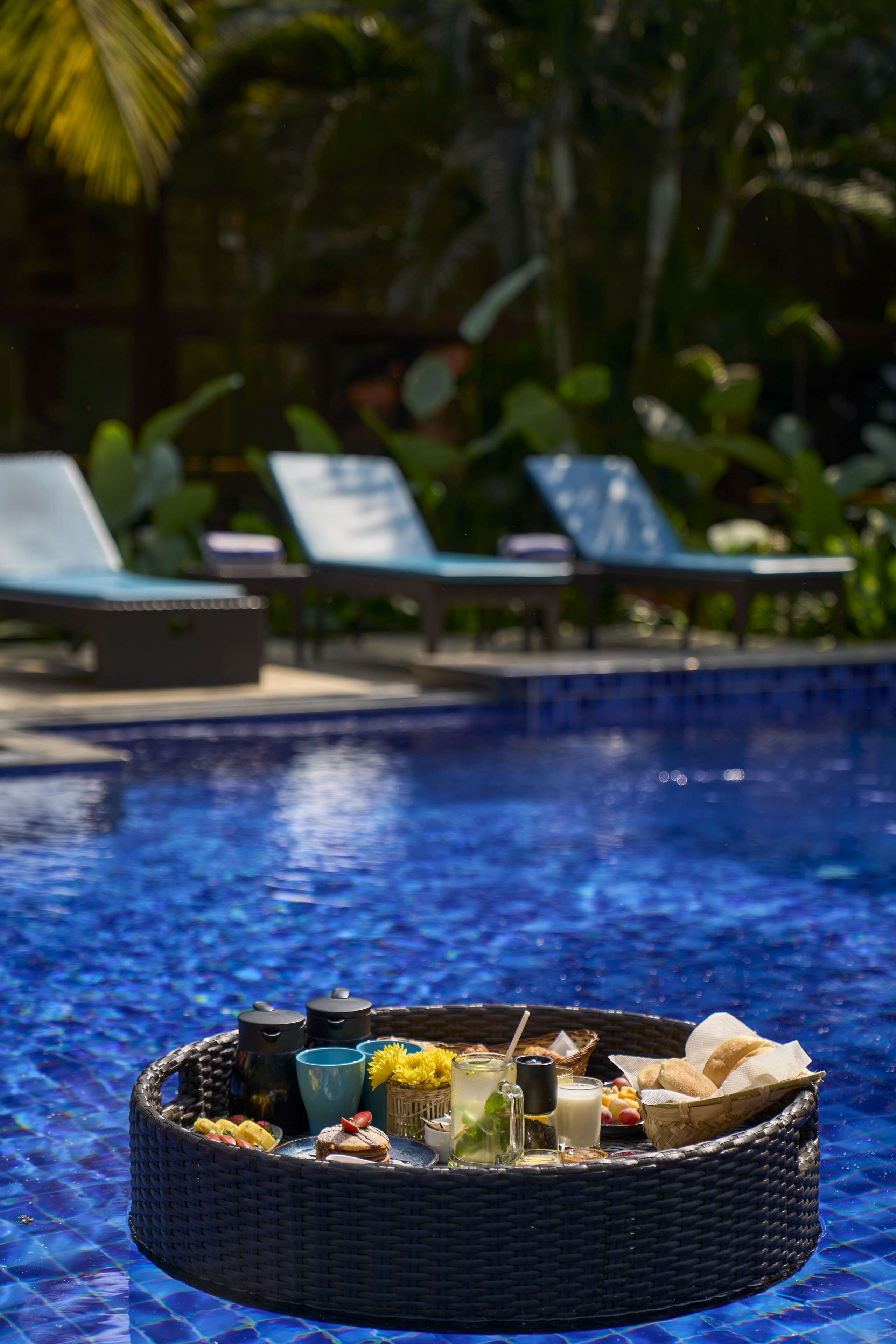 Outdoor pool, open 7:00 AM to 7:00 PM, pool loungers