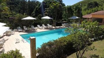 Indoor pool, outdoor pool, pool umbrellas, pool loungers