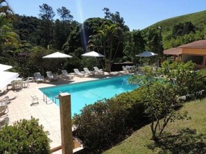 Indoor pool, outdoor pool, pool umbrellas, pool loungers