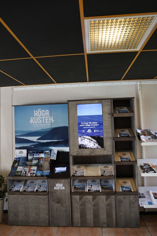 A display of books and a poster in a bookstore setting.