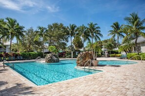 Outdoor pool, a heated pool - Genoa Vacation Rental: Stylish 2-BR Condo with Golf & Lake Views. Resort-Style Pool, Hot Tub, and Easy Access to Championship Golf. Minutes from Naples Beaches, 5th Avenue S, and Marco Island (Naples)