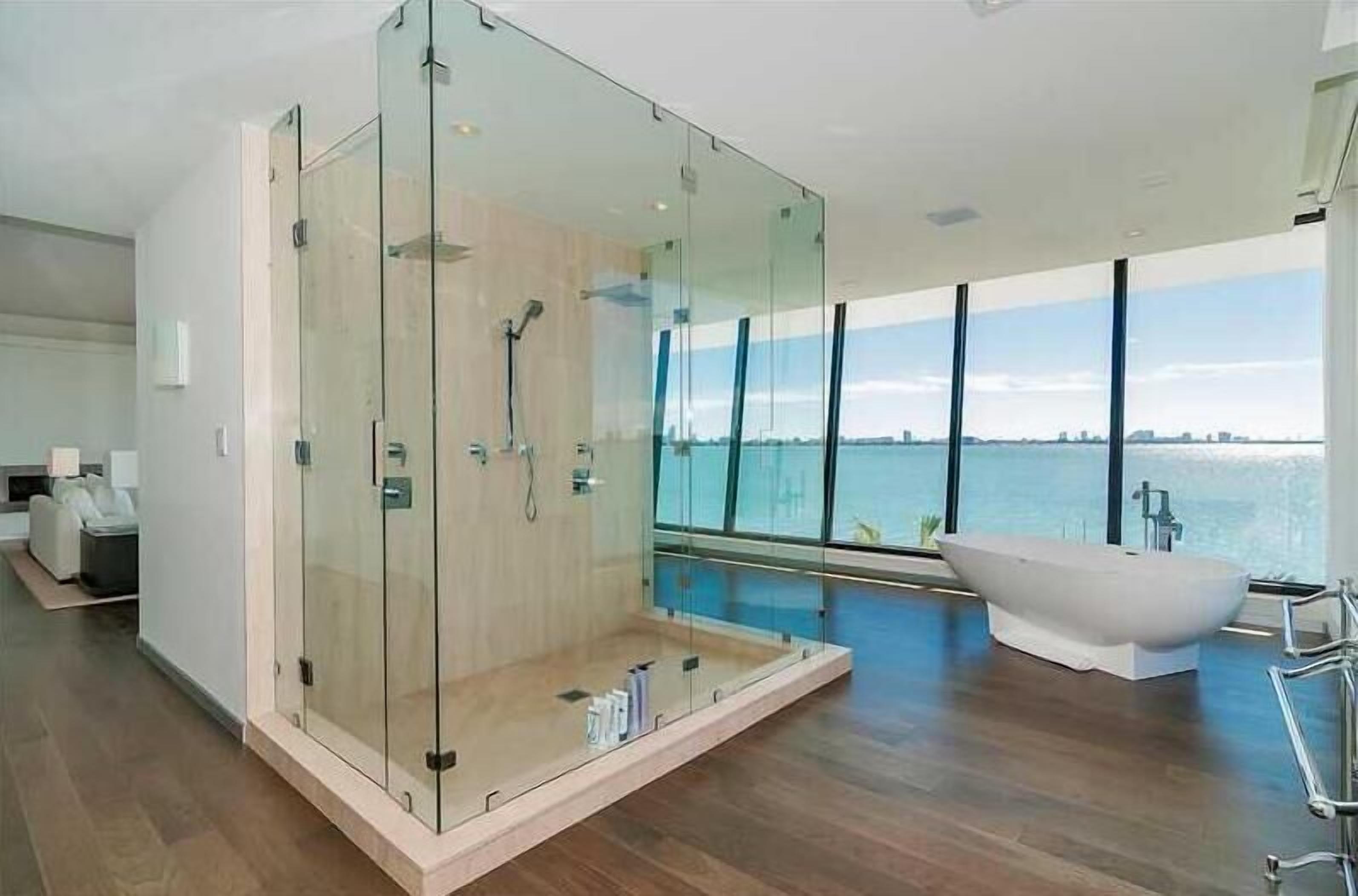 Separate bathtub and shower, bathrobes, slippers, towels