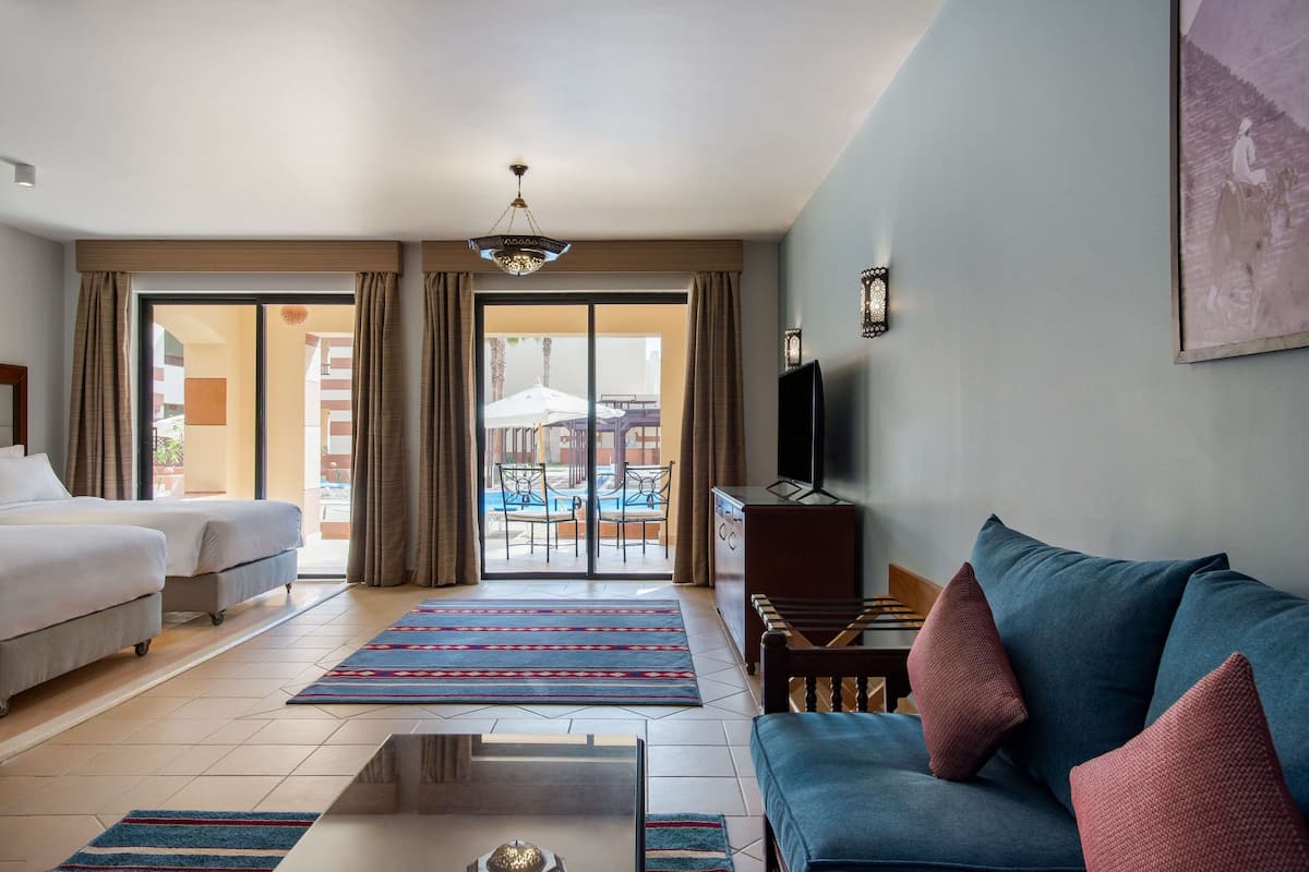 junior suite, pool view | 1 bedroom, minibar, in-room safe, individually furnished