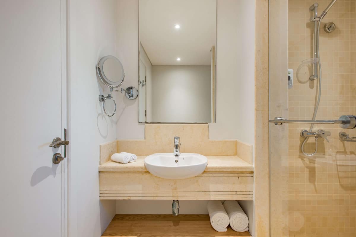 eco-friendly toiletries, hair dryer, slippers, bidet