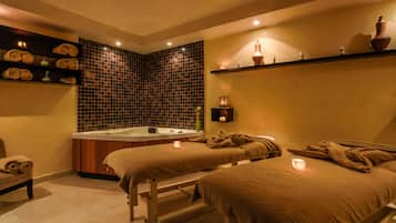 Experience a serene spa retreat with a hot tub, massage tables, and a relaxing ambiance.