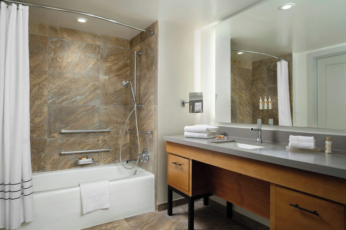 designer toiletries, hair dryer, towels, soap