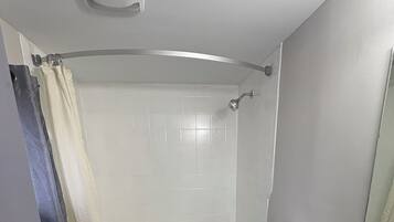 Standard Room, 1 King Bed | Bathroom | Combined shower/tub, rainfall showerhead, hair dryer, towels