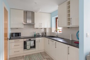 Apartment, 2 Bedrooms | Private kitchenette | Full-sized fridge, microwave, oven, stovetop