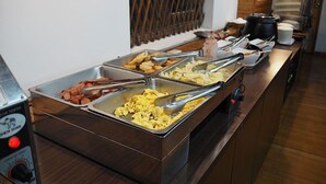 A buffet with various food items including scrambled eggs, sausages, and vegetables. - Jia Maei B&B (Ren'ai)