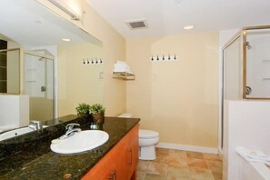 A bathroom with a large mirror, a sink, a toilet, and a shower area. - Fraser Crossing 3319 1 Bedroom Holiday Home by Winter Park Lodging Company (Winter Park)