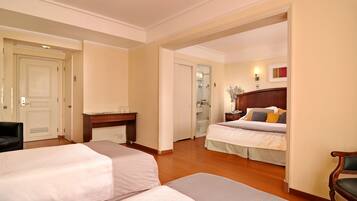 Family Room | Minibar, in-room safe, free WiFi, bed sheets